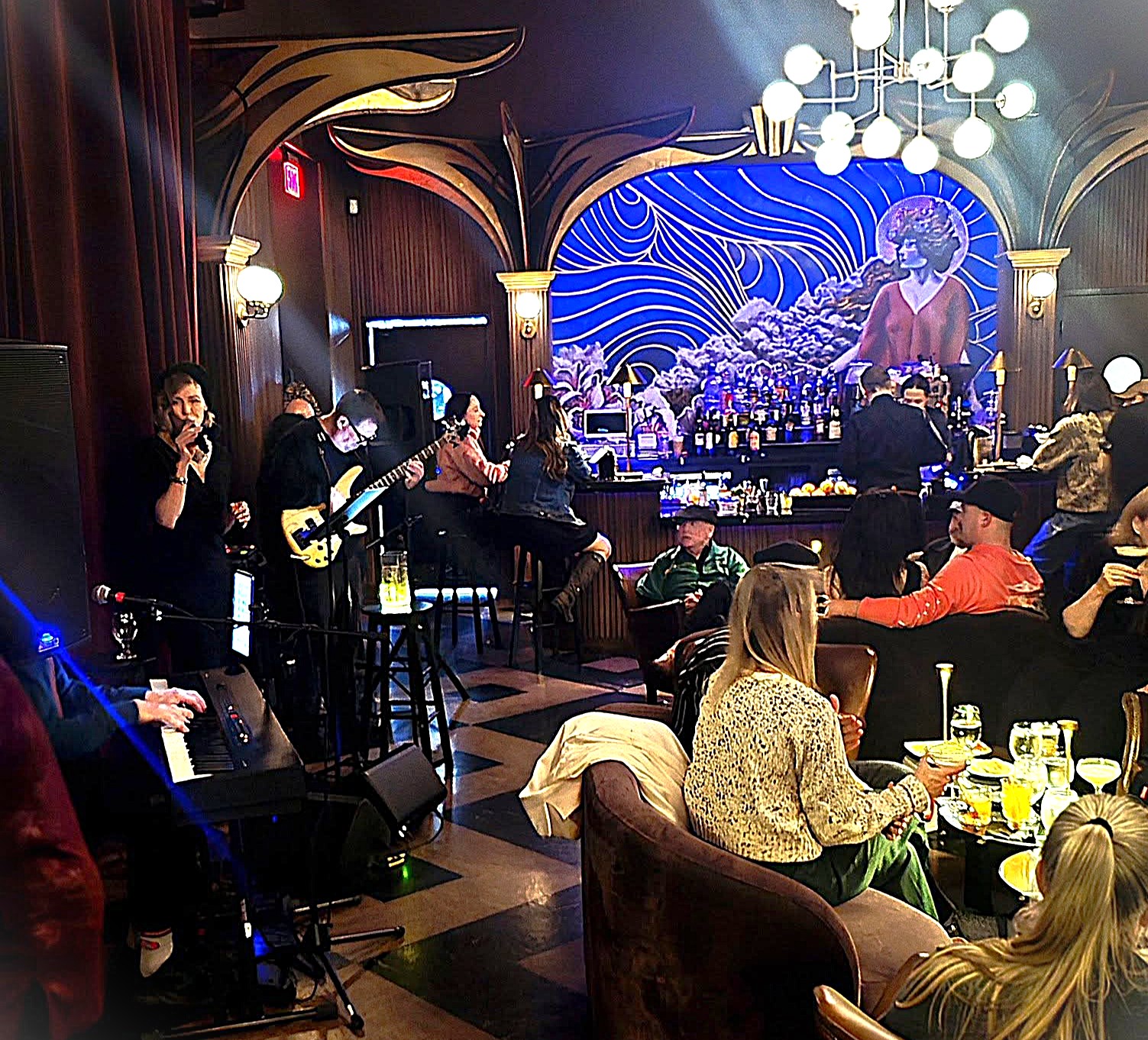Denise Choate singing with her jazz trio during a live performance at Intermission Jazz Night